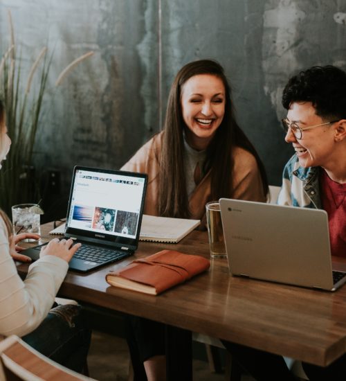 Group of laughing women at a business meeting