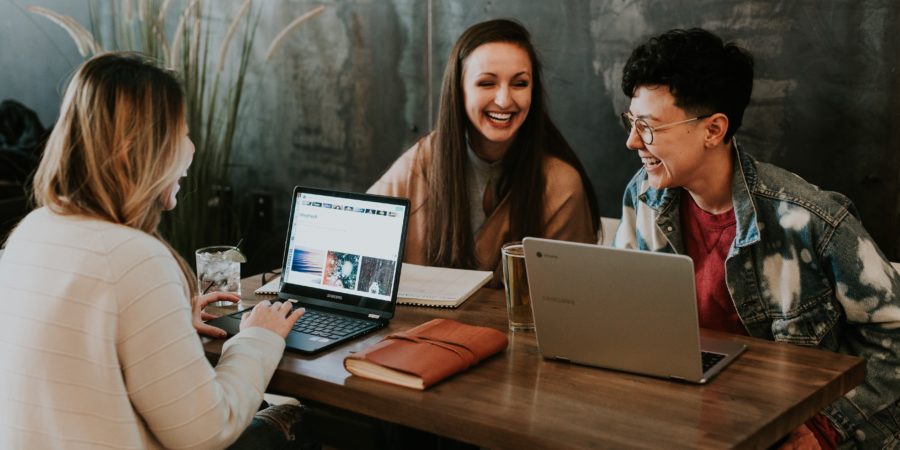 Group of laughing women at a business meeting